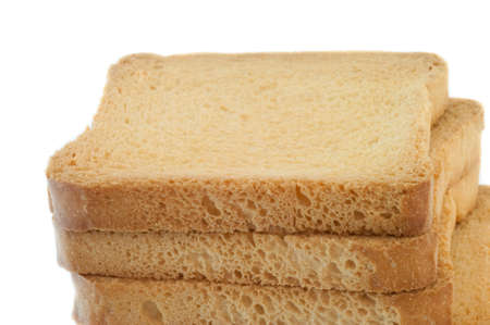 still life of golden rusk in a white backgroundの写真素材