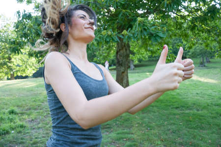 female athlete say ok with his handsの写真素材