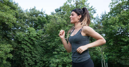 female athlete running on camaldoli parkの写真素材