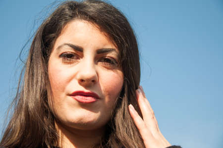 beautiful look of a beautiful girl in a sunny dayの写真素材