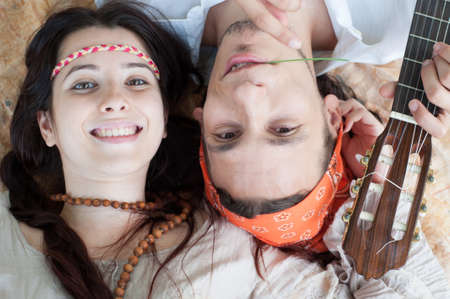 girl and boy hippies in a beautiful backgroundの写真素材