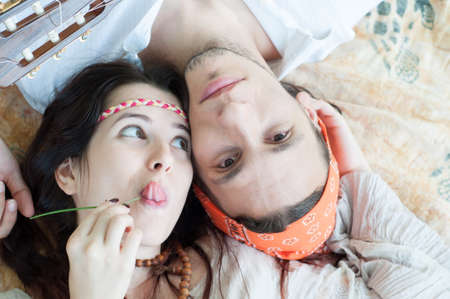 girl and boy hippies in a beautiful backgroundの写真素材