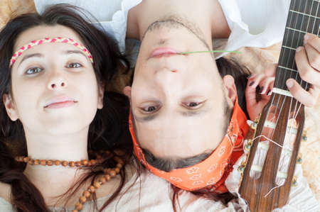 girl and boy hippies in a beautiful backgroundの写真素材