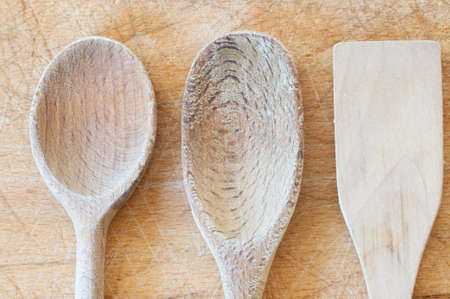 background of wood spoon on a cutting boardの写真素材
