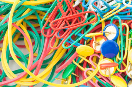 macro background of staples elastics and paper clips