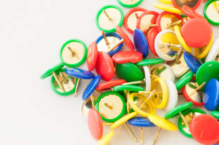 macro background of colored thumbtacks in studio