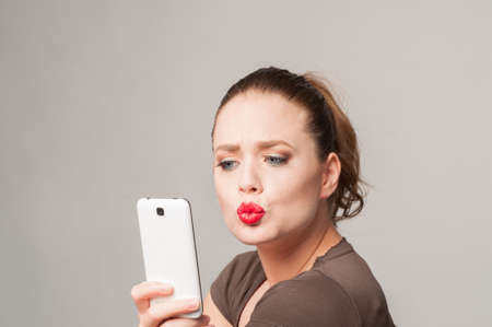 beautiful girl on the phoneの写真素材