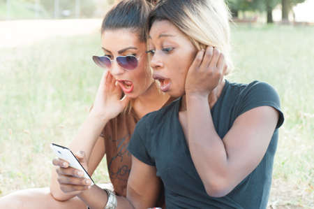 girl on the phone in a sunny dayの写真素材