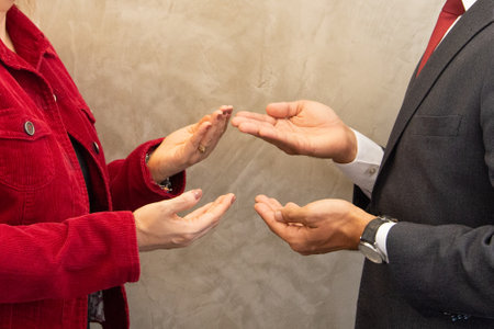 Businessman and businesswoman giving each other a high five. business conceptの写真素材