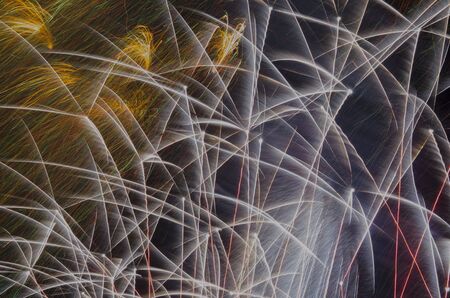 Spectacular fireworks show, color light sparks over black background.の写真素材