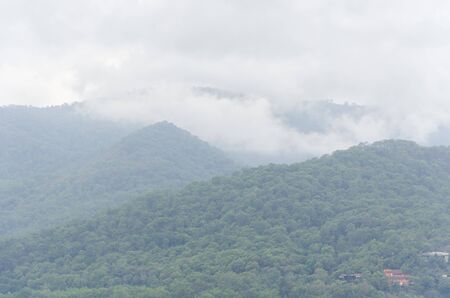 Cloudy mountainous landscape in Valle de Bravo, Mexicoの写真素材