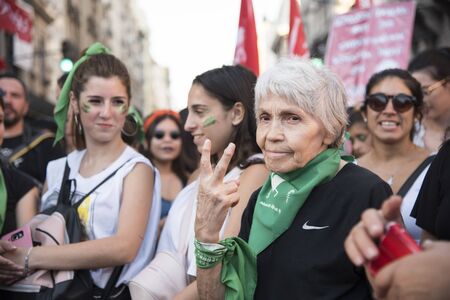 Capital Federal, Buenos Aires / Argentina; Feb 19, 2020: older and young women together in a rally in favor of the approval of the law of legal, safe and free abortion.のeditorial素材