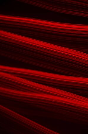 Elegant abstract background, red light lines on black backgroundの写真素材