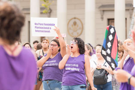 CABA, Buenos Aires / Argentina; March 9, 2020: international women's day. Women performing the zaghareet, the sororo scream, symbol of feminist causes, in a rally in favor of the legal, safe and free abortionのeditorial素材