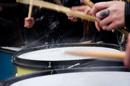 Capital Federal, Buenos Aires / Argentina; Oct 19, 2016: drums playing in the rain, detail of a demonstration against gender violence, black wednesday, not one lessのeditorial素材