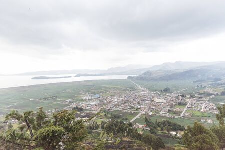 Panoramic view of Aquitania, in Boyaca, Colombia, and the fields that surround it; next to Lake...