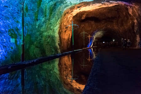 Nemocon, Cundinamarca / Colombia; March 24, 2018: mirror of water and walls illuminated with colored...