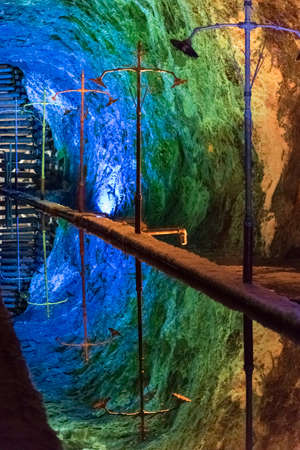 Nemocon, Cundinamarca / Colombia; March 24, 2018: mirror of water and walls illuminated with colored...