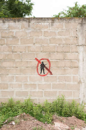 Carmelo, Colonia / Uruguay; Dec 27, 2018: concrete block wall with a painted symbol: a black...