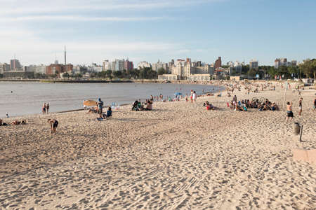 Montevideo / Uruguay, Dec 28, 2018: sandy beach along the bank of the Rio de la Plata, a summer eveningのeditorial素材