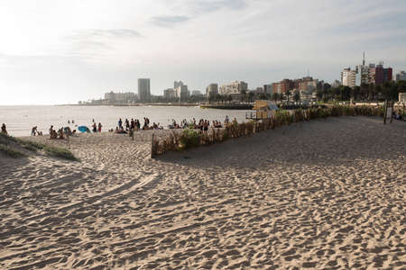 Montevideo / Uruguay, Dec 28, 2018: sandy beach along the bank of the Rio de la Plata, a summer eveningのeditorial素材