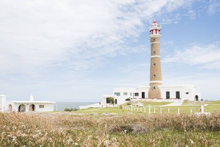 Cabo Polonio Lighthouse and meadow in summer, Rocha, Uruguay; a beautiful tourist destinationの写真素材