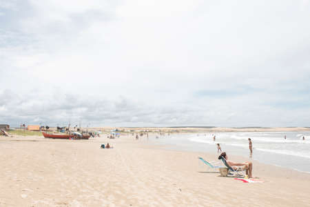 Cabo Polonio, Rocha / Uruguay; Dec 30, 2018: summer landscape, boats on the seashore and people enjoying on the beachのeditorial素材