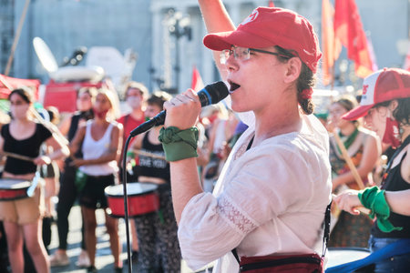 Buenos Aires, Argentina; Dec 10, 2020: Young woman shouting slogans at a mass rally next to the National Congress, in defense of the approval of the legal, safe and free abortion lawのeditorial素材