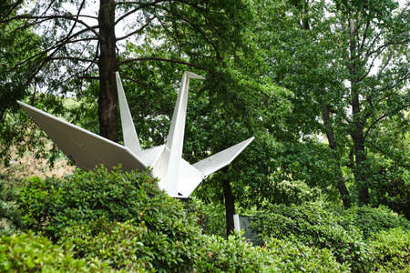 Buenos Aires, Argentina; March 17, 2021: sculpture of an origami crane, in the Japanese Garden, a quiet tourist site administered by the Argentine-Japanese Cultural Foundation. Image with copy space.のeditorial素材
