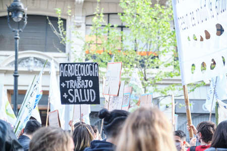 CABA, Buenos Aires, Argentina; Sept 24, 2021: Sign text: Agroecology equals more work and better health. Mass demonstration in the context of the Global Climate Strike.のeditorial素材