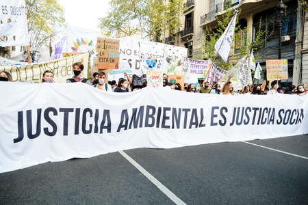 CABA, Buenos Aires, Argentina; Sept 24, 2021: Activism, people marching with a banner with the text...