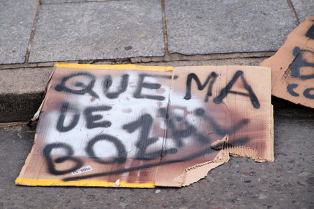 Buenos Aires, Argentina; Sept 24, 2021: Handwritten poster with the text Burn muzzle, protest against the use of protective face masks during the coronavirus pandemic.のeditorial素材