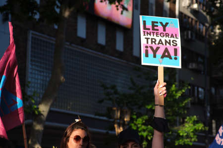 Buenos Aires, Argentina; Nov 6, 2021: LGBT Pride Parade. People with posters demanding the comprehensive trans law now. Respect to diversity.のeditorial素材
