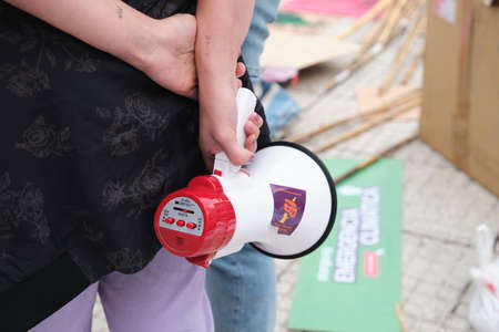 Buenos Aires, Argentina; April 22, 2022: preparations for the Earth Day demonstration, hands holding...