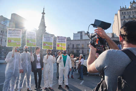 Buenos Aires, Argentina; May 21, 2022: unrecognizable journalist filming a group of activists...