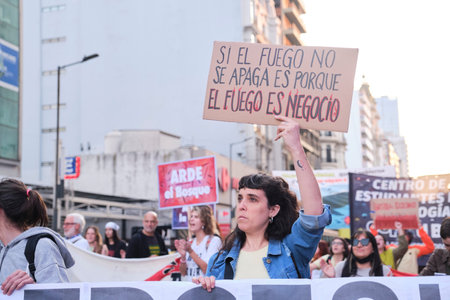 Buenos Aires, Argentina; August 25, 2022: Environmental activism, unrecognizable person holding a poster: Water for life, not for extractivism.のeditorial素材