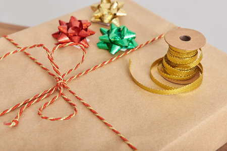 Decorative ribbons and bows on a wrapped Christmas present. Concept of preparing gifts for the...
