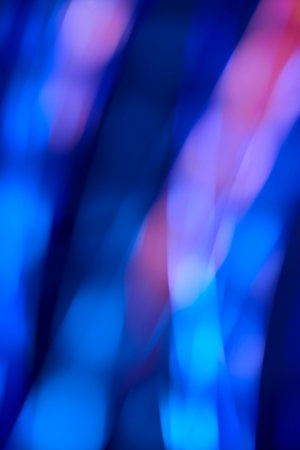 Abstract blurred background, dynamic flowing lights, motion design in blue and pink curve stripes