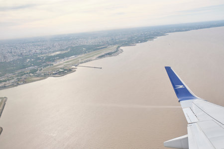 Buenos Aires, Argentina, November 18, 2022: View from a window of a Boeing 737-700 jet of Aerolineas Argentinas which has just taken off from Jorge Newbery International Airport.のeditorial素材