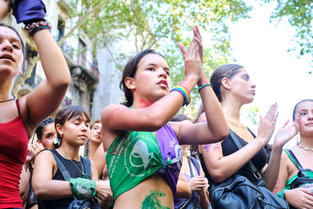 Buenos Aires, Argentina; March 8, 2023: international women's day, young woman wearing a rainbow bracelet, a green scarf, in favor of legal abortion, and a purple one, symbol of the feminist movement.のeditorial素材