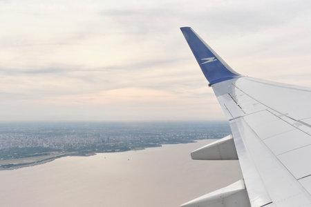 Buenos Aires, Argentina, November 18, 2022: View from a window of a Boeing 737-700 jet of Aerolineas Argentinas which has just taken off from Jorge Newbery International Airport.のeditorial素材