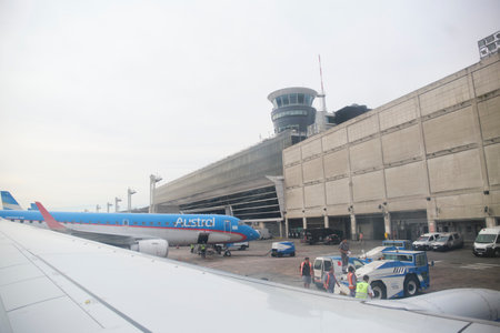Buenos Aires, Argentina, November 18, 2022: boarding area of the Jorge Newbery International Airport view from the window of a commercial parked aircraft.のeditorial素材