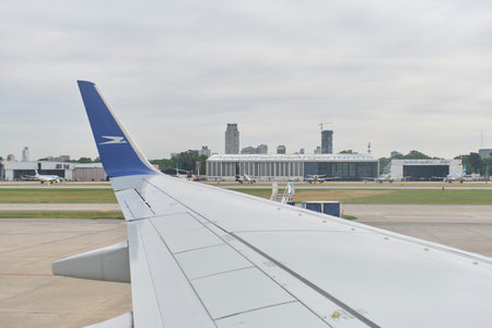 Buenos Aires, Argentina, November 18, 2022: Plane wing, view from a window of a Boeing 737-700 jet of Aerolineas Argentinas moving down the runway before takeoff, Jorge Newbery International Airportのeditorial素材