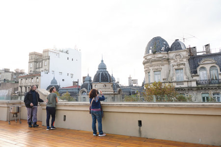 Buenos Aires, Argentina, May 20, 2023: Couple admiring the view from the Cassara Building observation deck.のeditorial素材