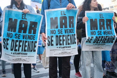 Buenos Aires, Argentina, Oct 5, 2023: people protesting against seismic exploration for offshore oil exploitation, holding posters with the text The sea is not for sale, it is defended.のeditorial素材