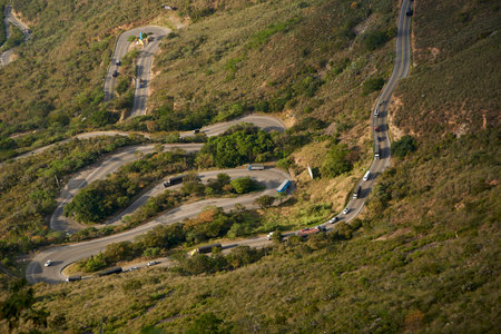 Aerial view of a winding mountain road with car and truck traffic, in Santander, Colombia