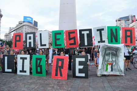 Buenos Aires, Argentina, Feb 16, 2024: People protesting in front of the obelisk, downtown, with...