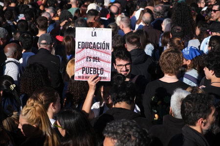 Buenos Aires, Argentina, April 23, 2024: Crowds of people marching through downtown protesting in...