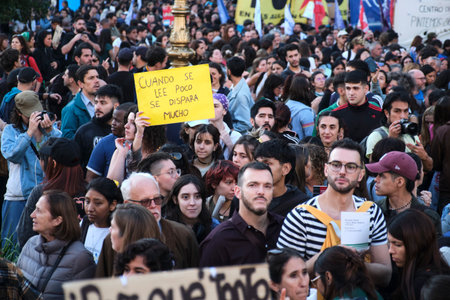 Buenos Aires, Argentina, April 23, 2024: Crowds of people marching, protesting in defense of public,...