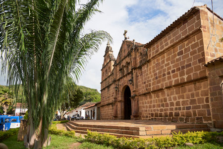 Guane, Santander, Colombia; November 26, 2022: Facade of the Santa Lucia de Guane Sanctuary, a small Catholic chapel of traditional colonial architecture, built in stone.のeditorial素材